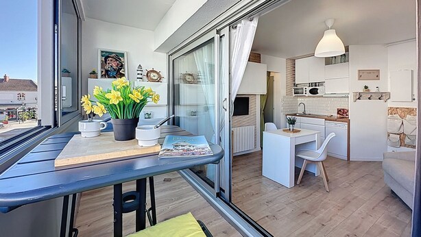 A modern apartment with a balcony, a dining area, and a kitchen. - Résidence de la Mer by Interhome (La Bernerie-en Retz)