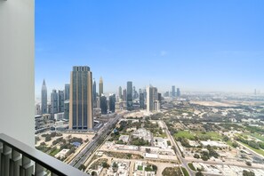 A cityscape with high-rise buildings, roads, and green spaces. - Silkhaus Ultra Luxury 1bdr Downtown Views II (Dubai)