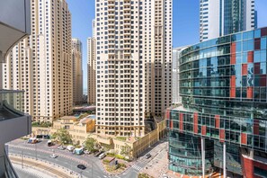 A high-rise building with a grid of windows, surrounded by other tall buildings. - Silkhaus Dubai Marina Studio Bay Central Tower (Dubai)