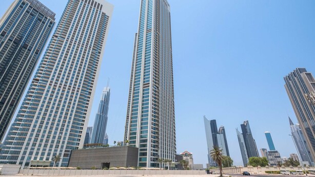 High-rise buildings with a modern architectural style, including a prominent building with the name 'EMAR' on it. - Silkhaus Stylish 2BR Downtown Views II Emaar (Dubai)