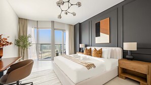 A modern hotel room with a large bed, a desk, and a view of the city. - Silkhaus 1bdr Executive Stay in Radiant Heights (Abu Dhabi)
