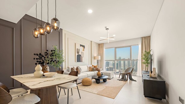 A modern living room with a dining area, a sofa set, and a large window offering a city view. - Silkhaus 1bdr Executive Stay in Radiant Heights (Abu Dhabi)
