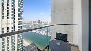 A balcony with a view of a marina and city skyline. - Silkhaus in Marina Vista Stunning 1bdr Sea View (Dubai)