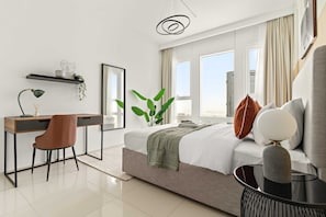 A modern hotel room with a bed, a desk, a chair, a large window, and a view of the city. - Silkhaus Serene 2BR Escape at Horizon in Reem Island (Abu Dhabi)