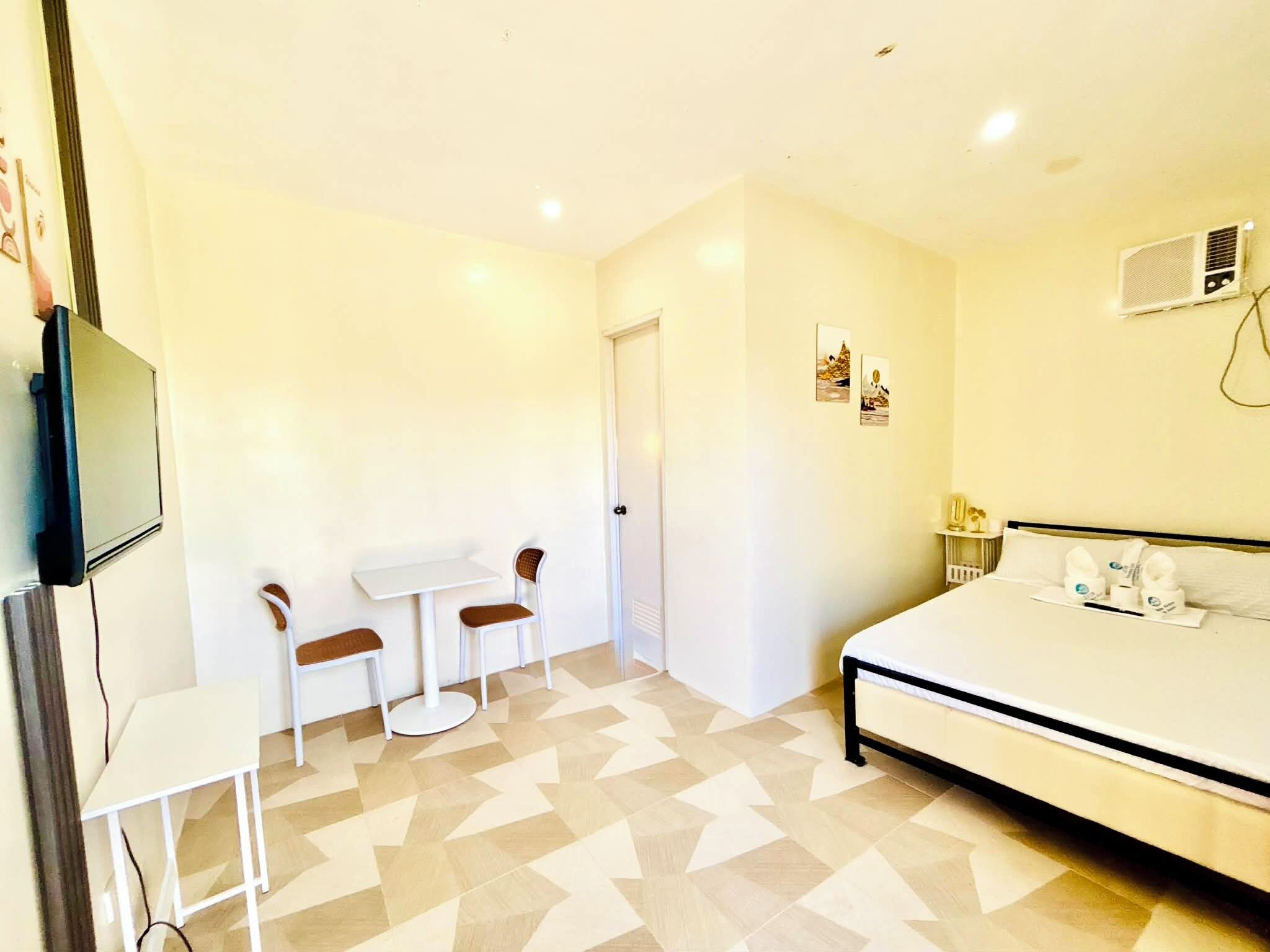 Desk, laptop workspace, blackout drapes, iron/ironing board