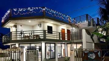 Desk, laptop workspace, blackout drapes, iron/ironing board