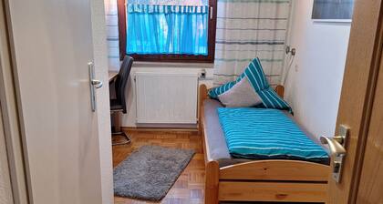 Single room with private bathroom and kitchenette.