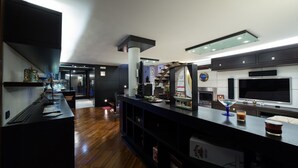 A modern kitchen with a wooden countertop, built-in appliances, and a large window. - The Shipowner's Villa - your retreat with a view and patio (Campania)