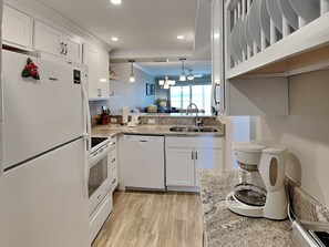 Fridge, microwave, oven, stovetop - Castle Beach 105 | Gulf-Front Retreat w/ Private Lanai + Pool (Fort Myers Beach)