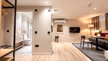 Suite estudio Prestigio | Área de sala de estar