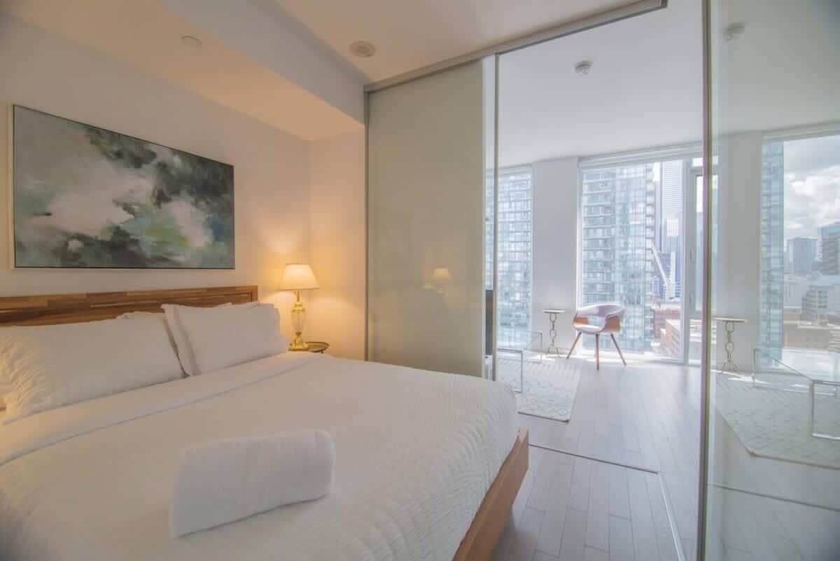 Bedroom featuring a cozy queen sized bed