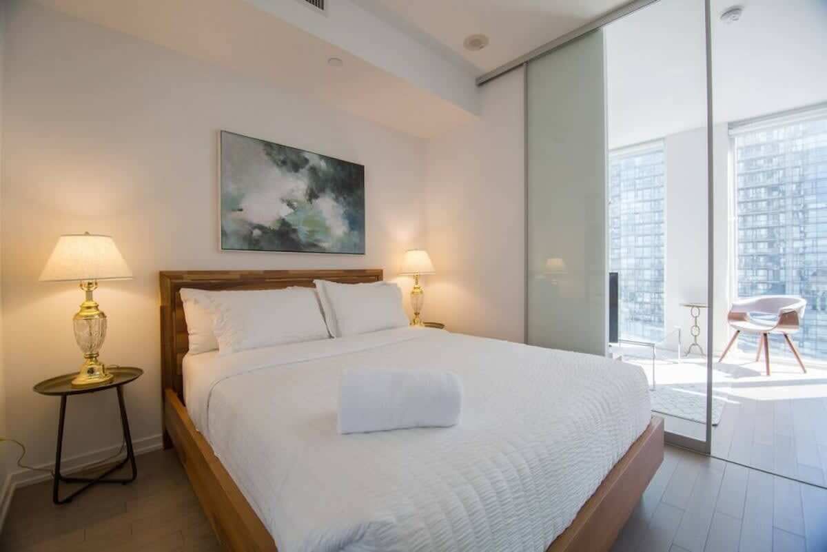 Bedroom featuring a cozy queen sized bed