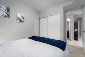Bedroom featuring a cozy queen bed featuring a spacious closet - Modern Condo + 1 BDRM/1 BA + Downtown! (Toronto)