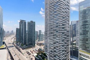 Modern building exterior with well-maintained design and welcoming appeal. - Lux 1 BR-Den DWTN Condo near CN Tower (Toronto)
