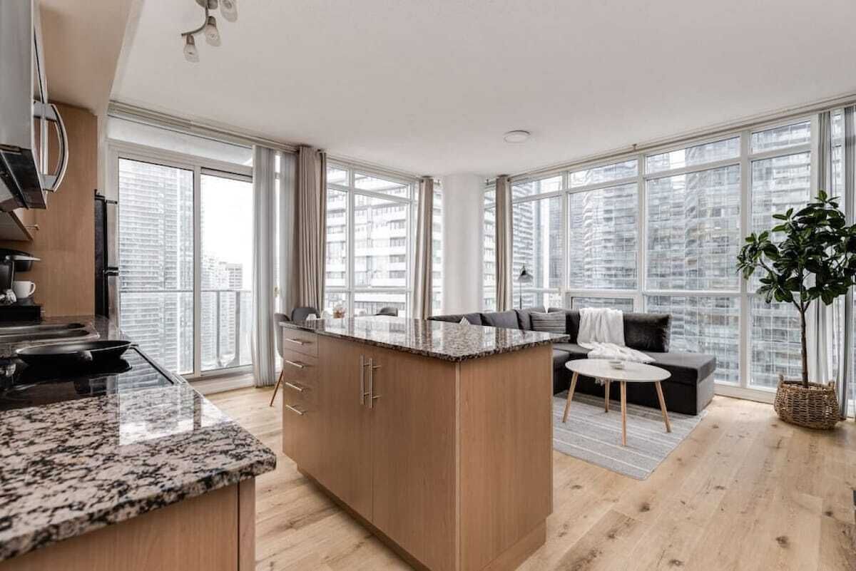 Open concept living space featuring floor-to-ceiling window plus great city view!