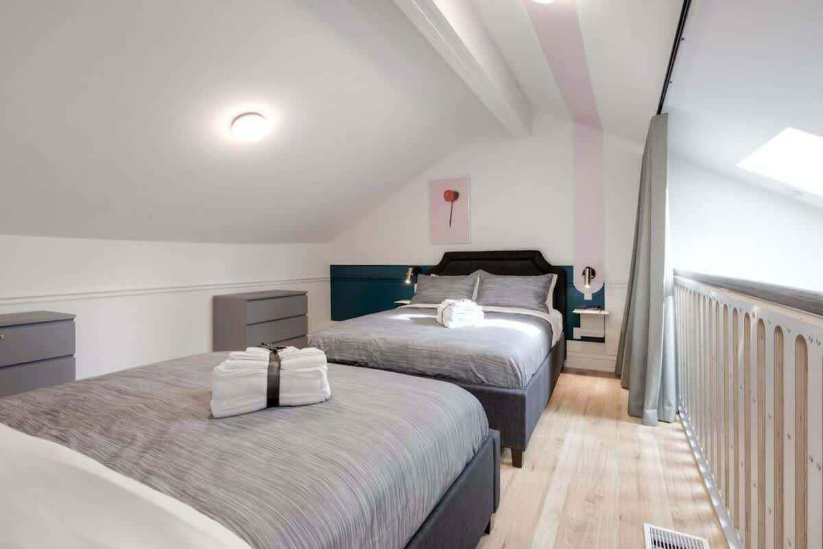 The den area above the living room with 2 warm Queen size beds.