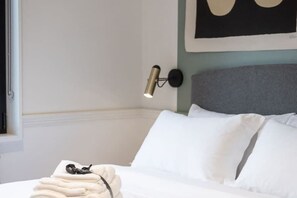 On the bed, there are also extra towels provided for your use. - Chic Oasis above a resto on trendy Queen West! (Toronto)