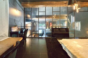 A modern room with a large window, a desk, a chair, and a bed. - Magnifique Maison historique (Saint Paul de Vence)