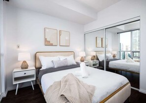 Bedroom featuring a warm queen size bed - Charming 1BR+Den in Downtown Toronto with Balcony (Toronto)