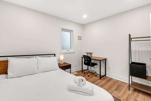 Get down to business in your bedroom's dedicated workspace, surrounded by hotel-quality bed sheets for a restful night's sleep! - Cozy 2BR Home with Workspace | Toronto Retreat (Toronto)
