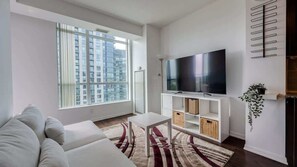 Modern open concept living area - Modern Lakeview Retreat, 1BR Condo + Den w/Balcony (Toronto)