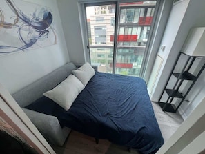 endlessly practical: The sofa bed for modern living. - Modern 1BR/1BA condo near Downtown with City Views (Toronto)