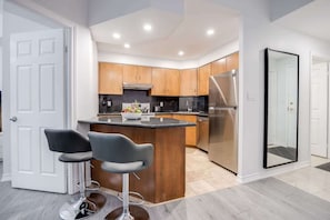 The full stock kitchen boasted gleaming stainless steel appliances, ample counter space, and every culinary tool imaginable, ensuring every meal was a gourmet delight. - Modern 1BR/1BA condo near Downtown with City Views (Toronto)