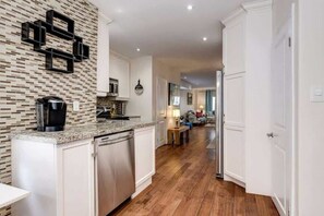 Kitchen equipped with appliances and cooking wear