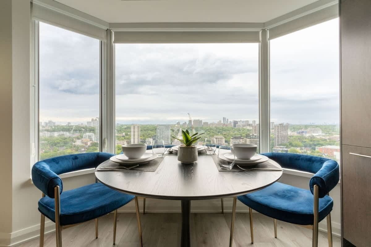 Enjoy meals with a view in this dining area featuring big city-facing windows.