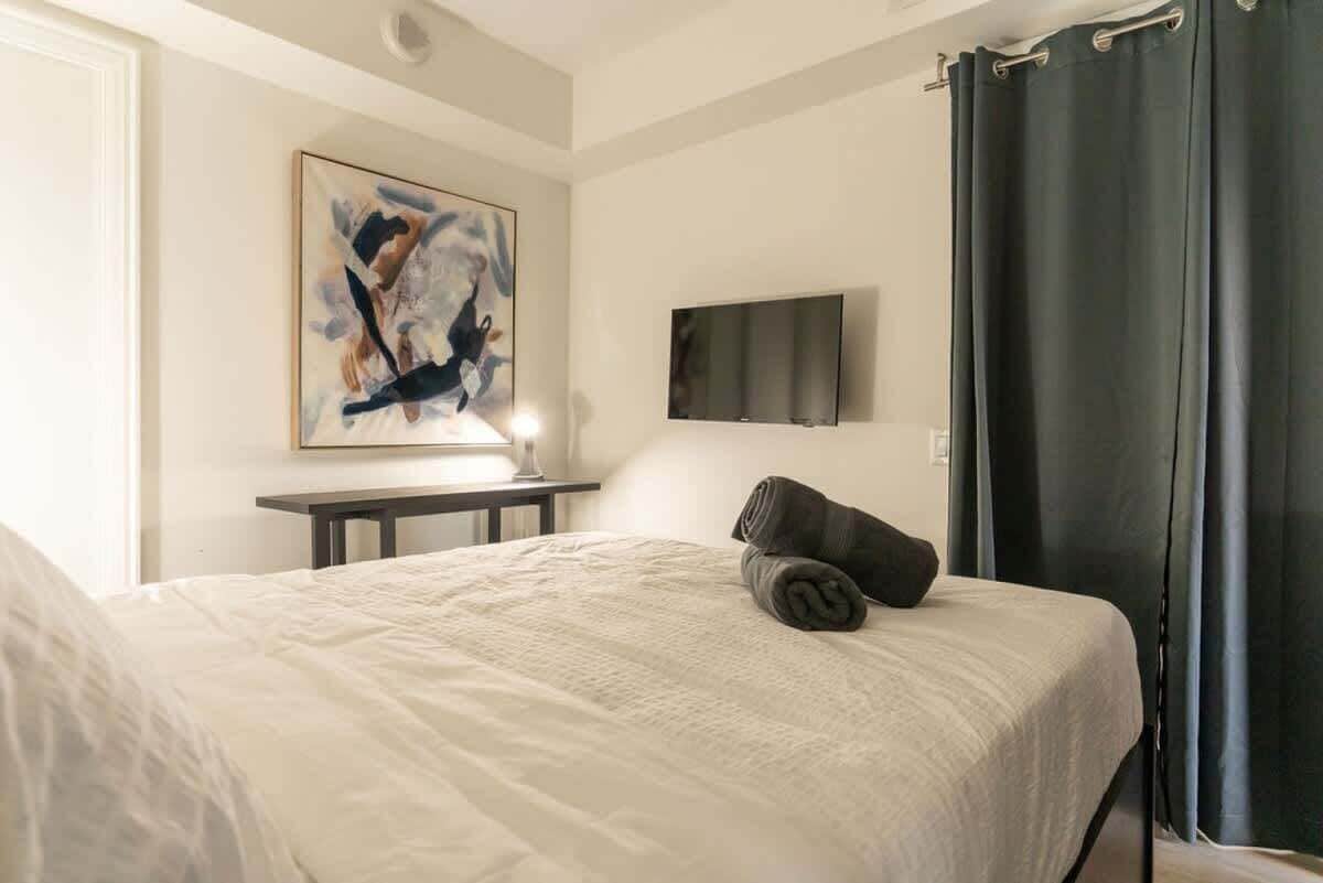 Relax and recharge in this bedroom with a cozy queen bed