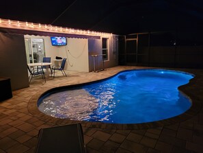 Outdoor pool, a heated pool - The Summer Hideout - Spacious house, heated pool, grill, beach gear (Cape Coral)