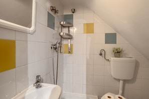 A bathroom with a shower, toilet, and sink. - Alfama Tiny by Homing (Lisbon)