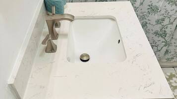 Shower, towels, soap, toilet paper