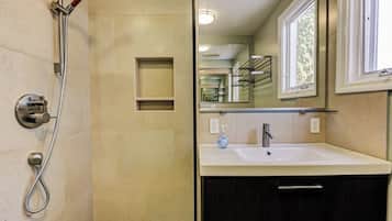 Shower, hair dryer, towels, toilet paper