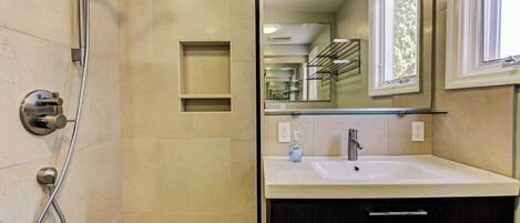 Shower, hair dryer, towels, toilet paper