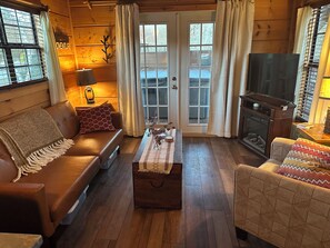 Living area - Riverfront Escape: Fire Pit, private hot tub, river fun, sleeps 6 (Newland)