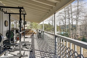 A covered outdoor area with exercise equipment, a dining table, and chairs. - Steps to Lake Isabel & Trails! Mtn-View Hideaway (Rye)