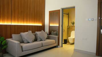 Comfort Suite, City View | Living area | 30-inch flat-screen TV with digital channels