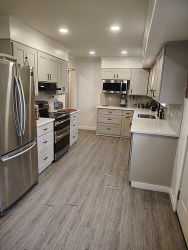 3-bedroom house with back patio and screened in porch.