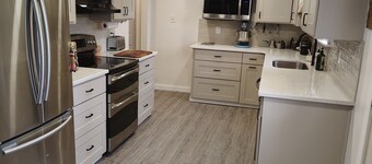 3-bedroom house with back patio and screened in porch.