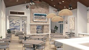 A modern restaurant with a stone fireplace, dining tables, and ceiling fans. - Luxurious 2+ BR villa:highly sought after Naples Reserve for annual & seasonal (Naples)