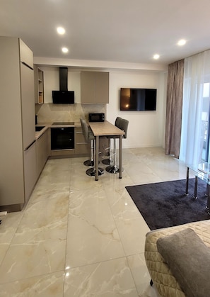 Apartment, Balcony, City View | Private kitchen | Full-size fridge, microwave, oven, stovetop