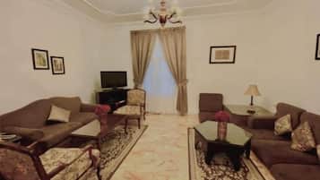 Apartamento família, 2 quartos | Área de estar