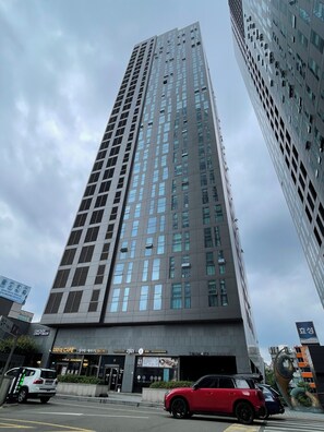 A tall, modern building with a grid of windows and a flat facade. - [Livelike Seoul] Seoul Stn. Corner House - Perfect Travel Hub (Seoul)