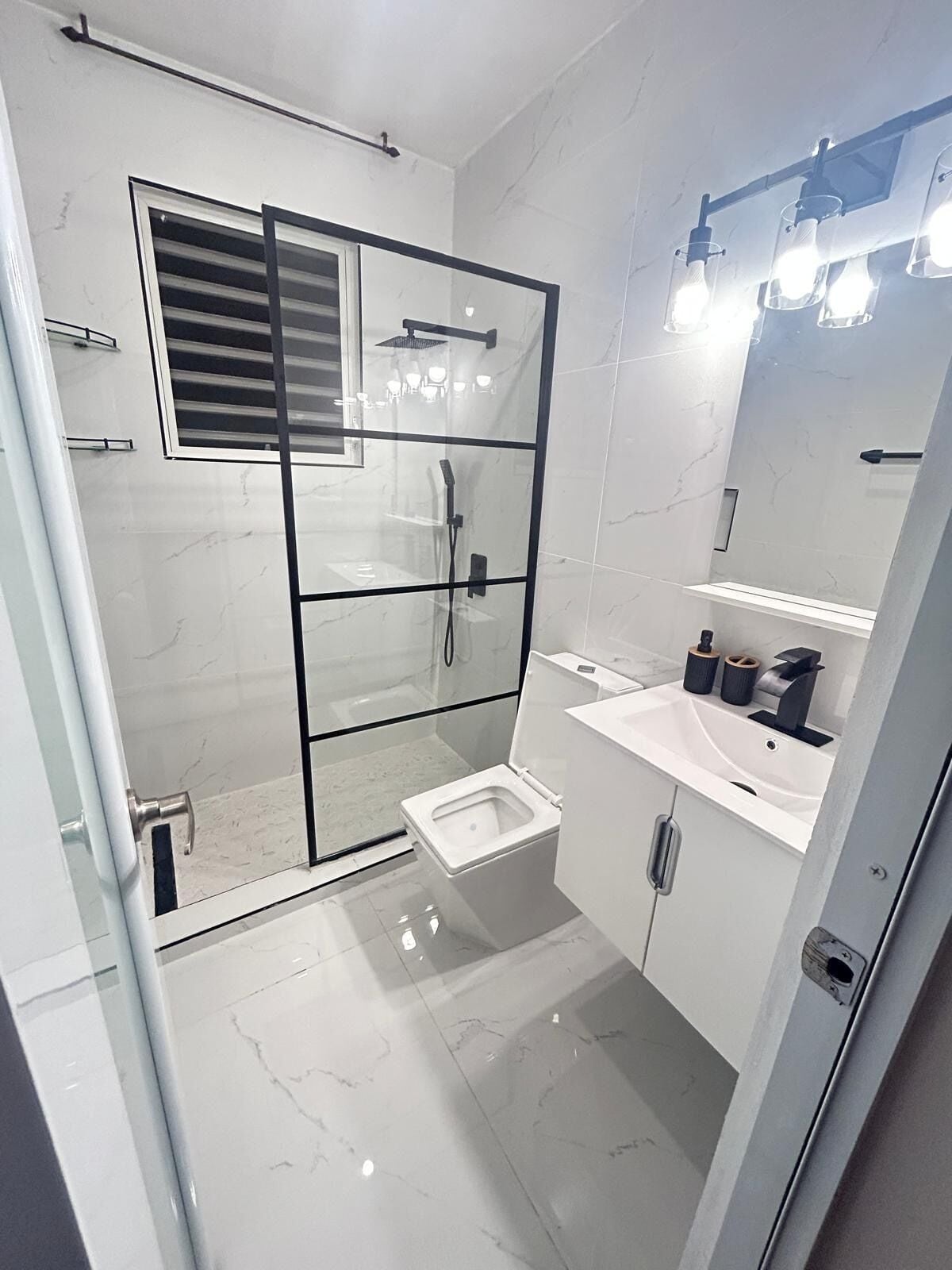 Shower, towels, soap, toilet paper