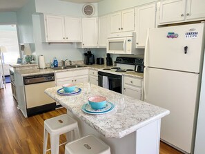 Fridge, microwave, oven, stovetop - 3-bedroom condo at Ocean Isle Beach with ocean view. (Ocean Isle Beach)