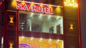 A hotel named SKY HOTEL with a sign for G.V. TOWER and a sign for KAJARIA. - Sky Hotel (Lucknow)