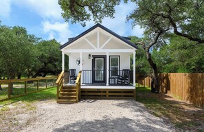 Exterior - The Live Oak Tiny House with fence (Rockport)