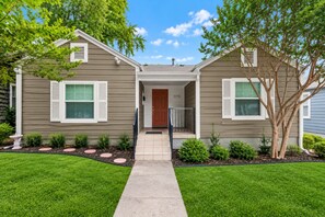 A two-story house with a front entrance, a mailbox, and a number '3716' on the door. - Cozy home in Ft Worth, walk to Dickies Arena & Will Rogers Coliseum horse show (Fort Worth)
