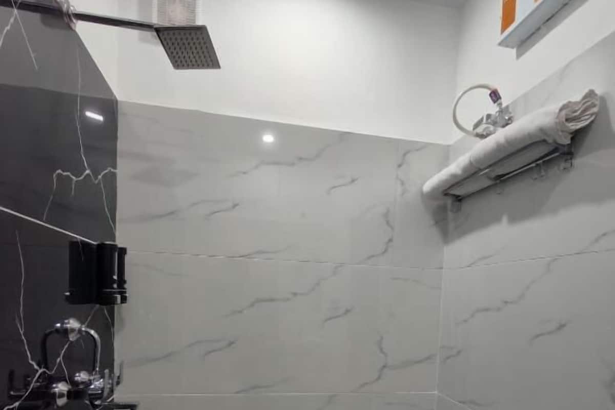 Shower, free toiletries, slippers, towels